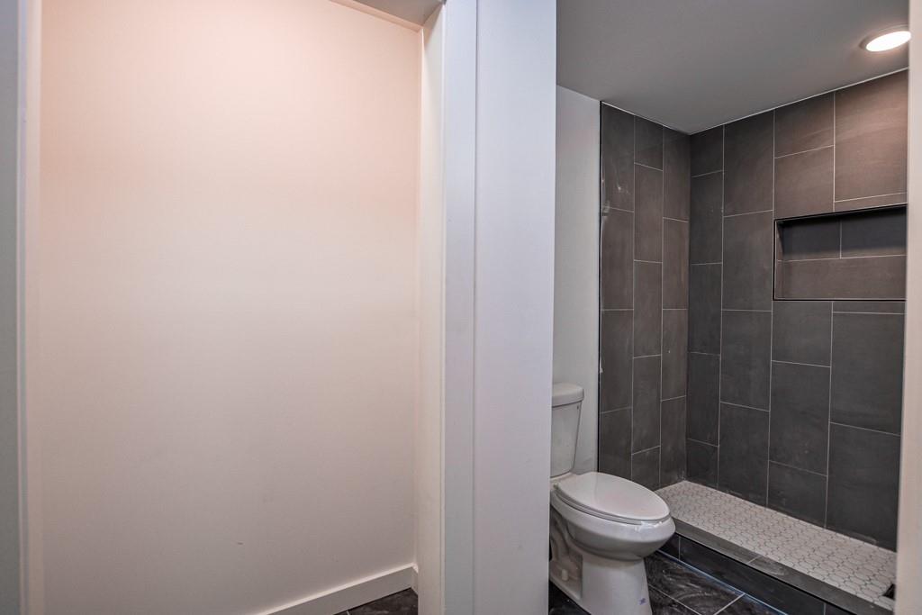 3349 Calhoun Road Northeast Rome, GA 30161 - Photo 24 of 30 a bathroom with a sink and a toilet