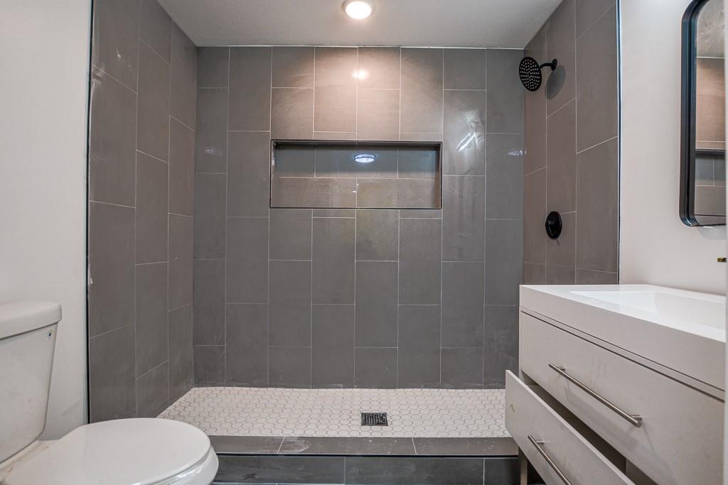 3349 Calhoun Road Northeast Rome, GA 30161 - Photo 26 of 30 a bathroom with a sink toilet and shower