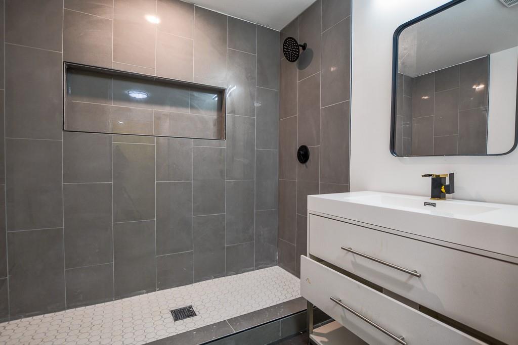 3349 Calhoun Road Northeast Rome, GA 30161 - Photo 27 of 30 a bathroom with a sink a toilet and shower