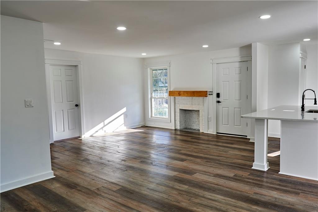 3349 Calhoun Road Northeast Rome, GA 30161 - Photo 6 of 30 a view of kitchen with furniture and wooden floor