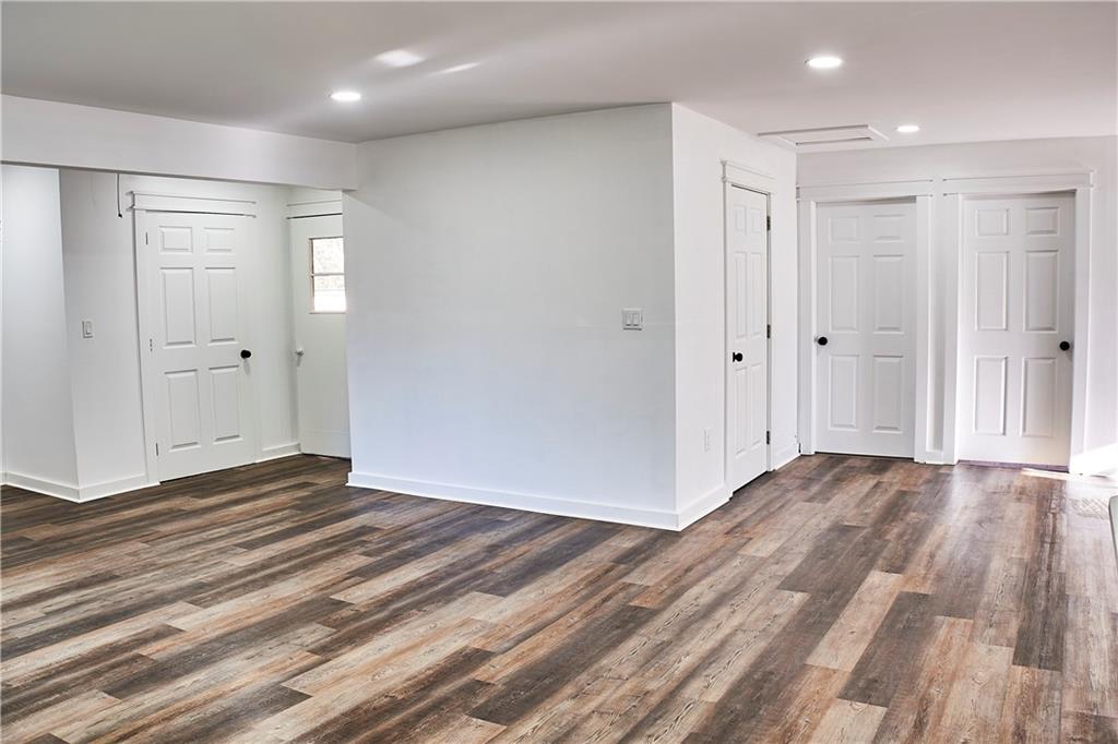 3349 Calhoun Road Northeast Rome, GA 30161 - Photo 7 of 30 a view of an empty room and wooden floor