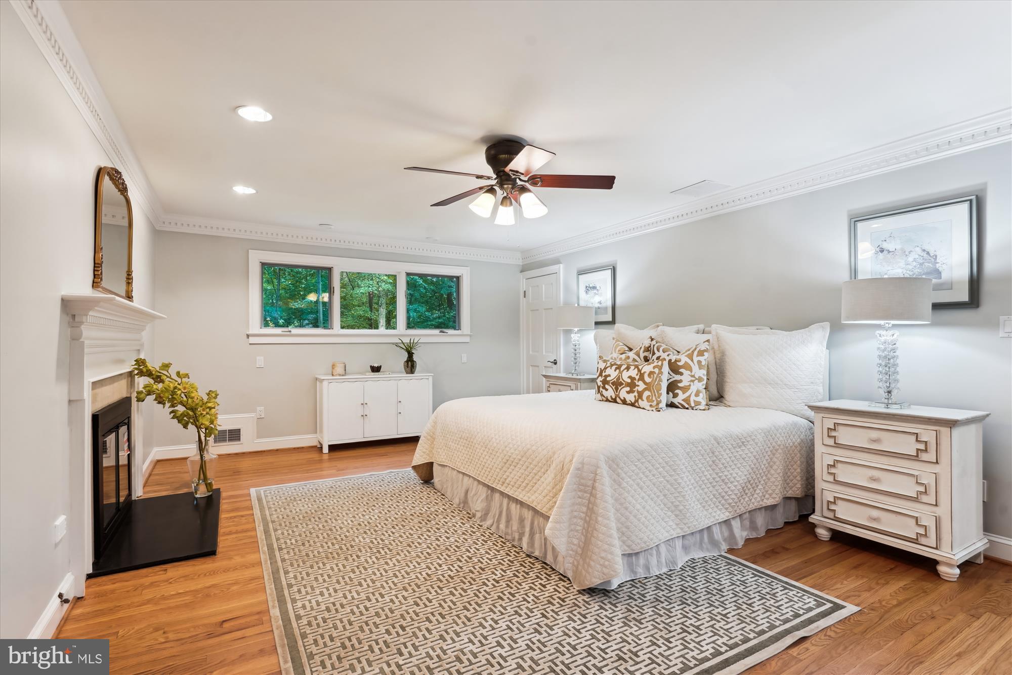 2559 Five Oaks Road Vienna, VA 22181 - Photo 25 of 55 a spacious bedroom with a bed and a chandelier