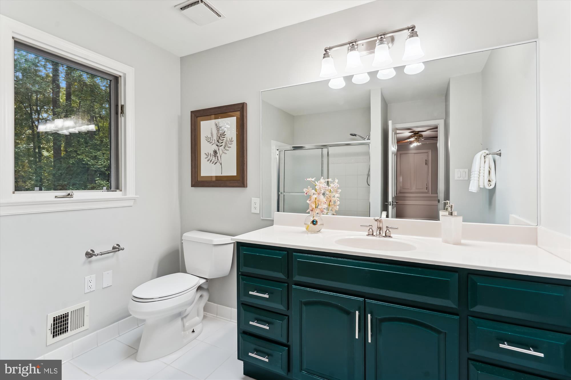 2559 Five Oaks Road Vienna, VA 22181 - Photo 35 of 55 a bathroom with a double vanity sink toilet and a mirror