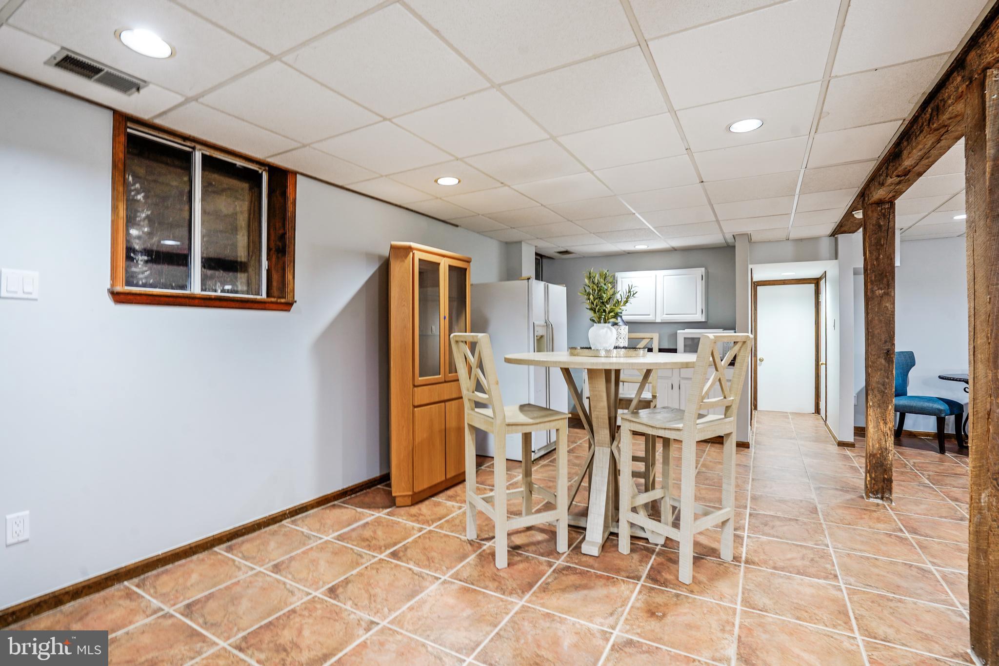 2559 Five Oaks Road Vienna, VA 22181 - Photo 37 of 55 a dining room with furniture and a table and chairs