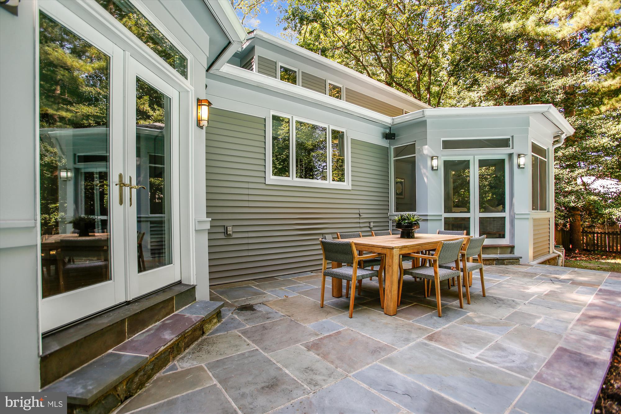 2559 Five Oaks Road Vienna, VA 22181 - Photo 47 of 55 a view of a patio with table and chairs and floor to ceiling window