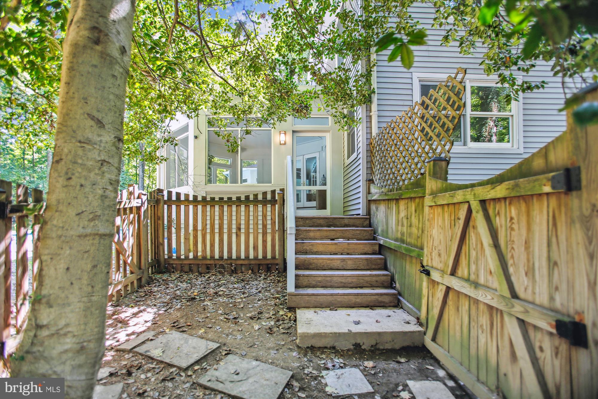 2559 Five Oaks Road Vienna, VA 22181 - Photo 51 of 55 a view of a pathway of a house with wooden floor and fence
