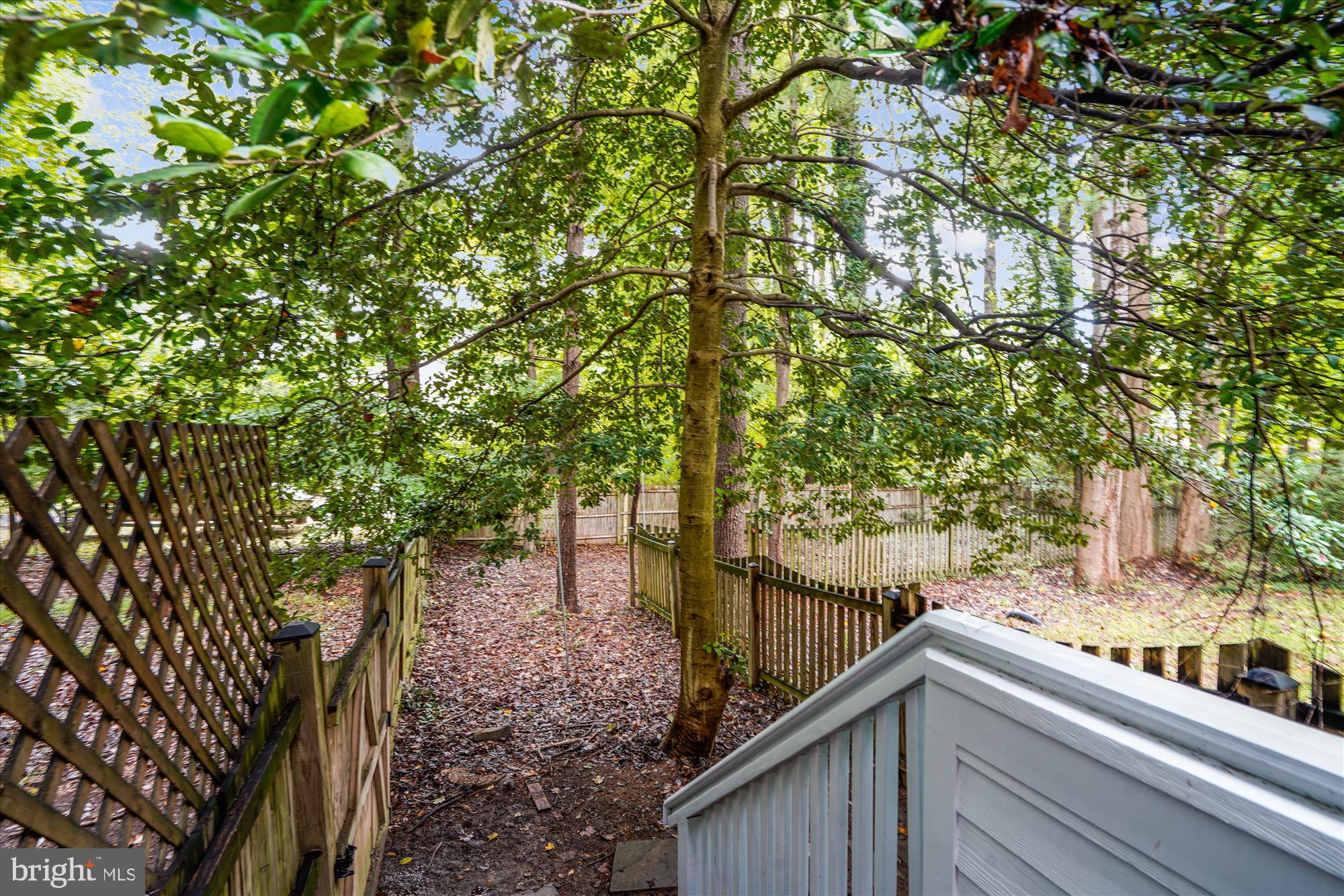2559 Five Oaks Road Vienna, VA 22181 - Photo 52 of 55 a view of balcony with wooden floor and fence
