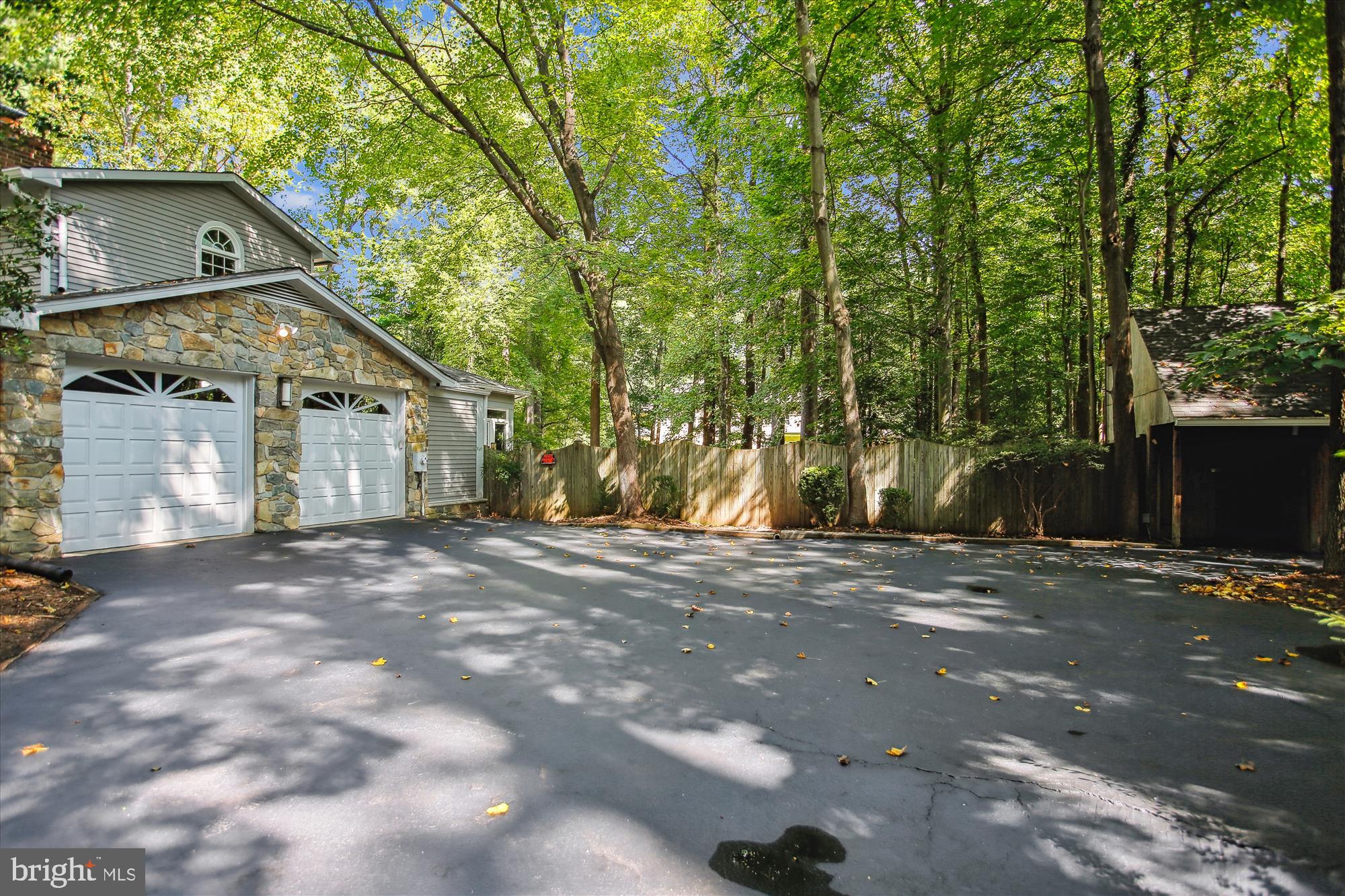 2559 Five Oaks Road Vienna, VA 22181 - Photo 55 of 55 a view of a large house with a tree in front
