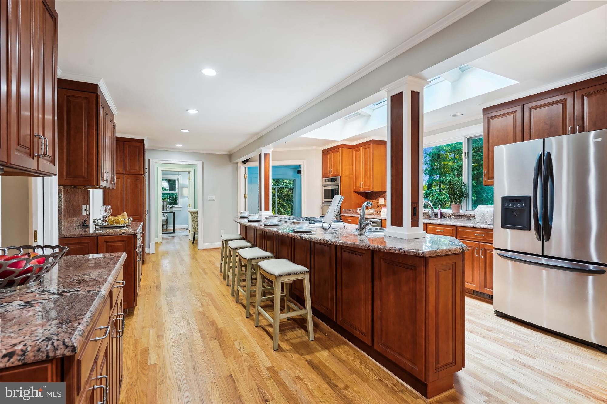 2559 Five Oaks Road Vienna, VA 22181 - Photo 7 of 55 a kitchen with stainless steel appliances granite countertop a refrigerator a stove and a wooden floors