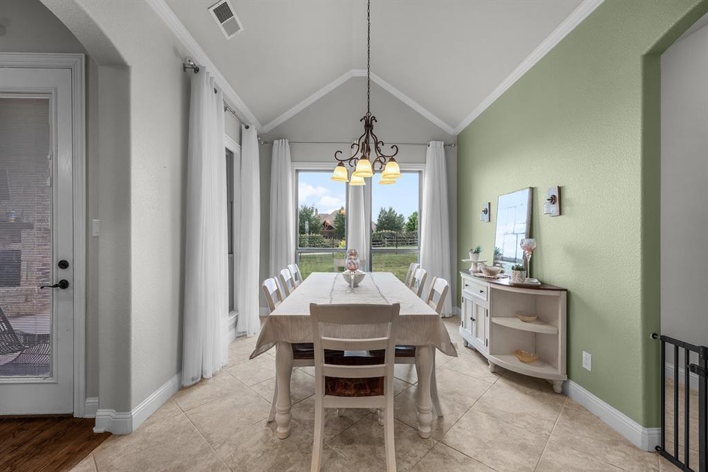 228 Parc Oaks Drive Aledo, TX 76008 - Photo 12 of 40 a living room with furniture and a chandelier