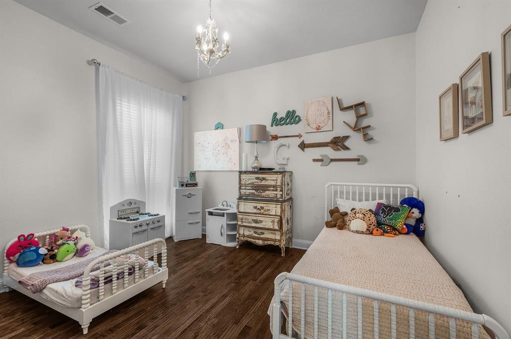 228 Parc Oaks Drive Aledo, TX 76008 - Photo 20 of 40 a bedroom with furniture and a wooden floor