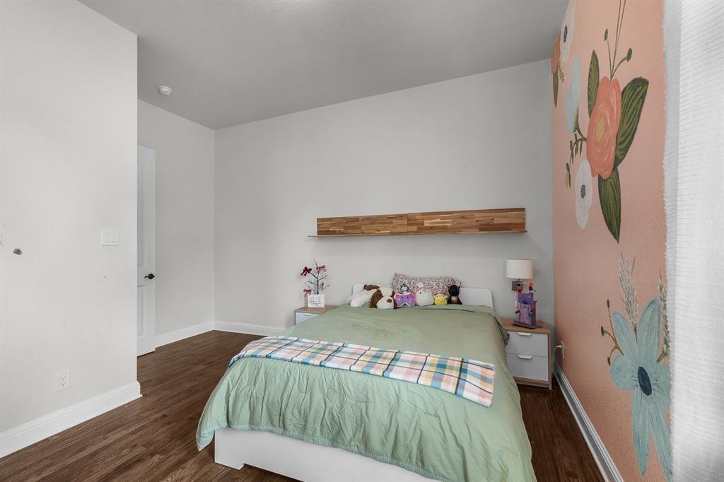 228 Parc Oaks Drive Aledo, TX 76008 - Photo 24 of 40 a bedroom with a bed and a window