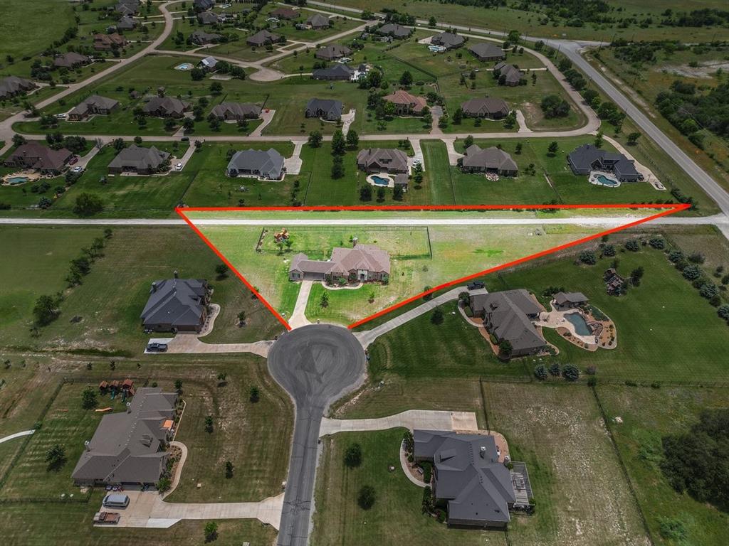 228 Parc Oaks Drive Aledo, TX 76008 - Photo 3 of 40 an aerial view of a house with a garden