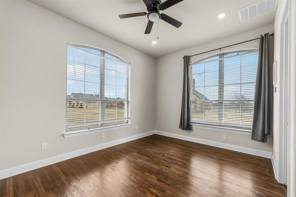 228 Parc Oaks Drive Aledo, TX 76008 - Photo 33 of 40 a view of an empty room with a window and wooden floor