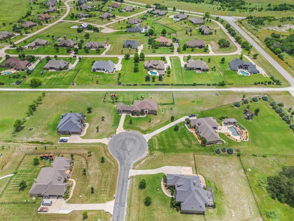 228 Parc Oaks Drive Aledo, TX 76008 - Photo 40 of 40 an aerial view of a swimming pool with a yard