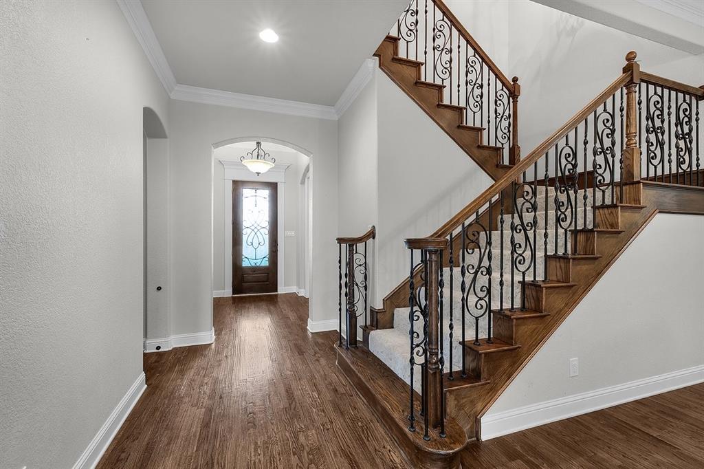 228 Parc Oaks Drive Aledo, TX 76008 - Photo 8 of 40 a view of entryway with wooden floor and stairs