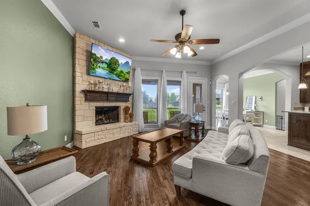 a living room with furniture and a fireplace