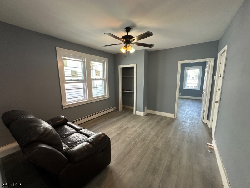 426 Franklin Street, Unit 2 Elizabeth Port, NJ 07206 - Photo 11 of 18 a living room with furniture and a window