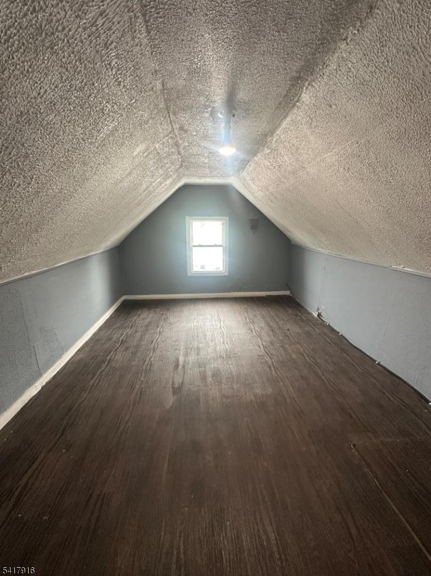 426 Franklin Street, Unit 2 Elizabeth Port, NJ 07206 - Photo 14 of 18 an empty room with wooden floor and windows