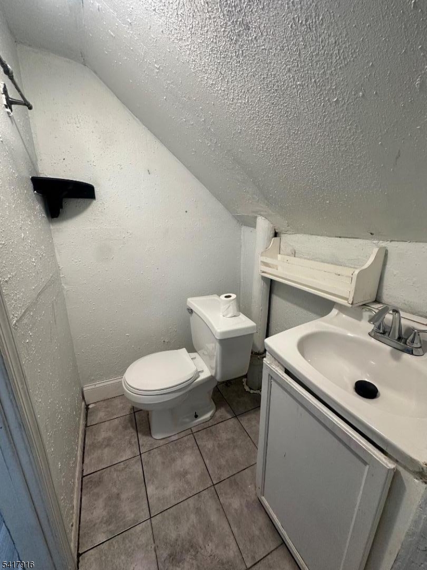 426 Franklin Street, Unit 2 Elizabeth Port, NJ 07206 - Photo 16 of 18 a bathroom with a sink and a toilet