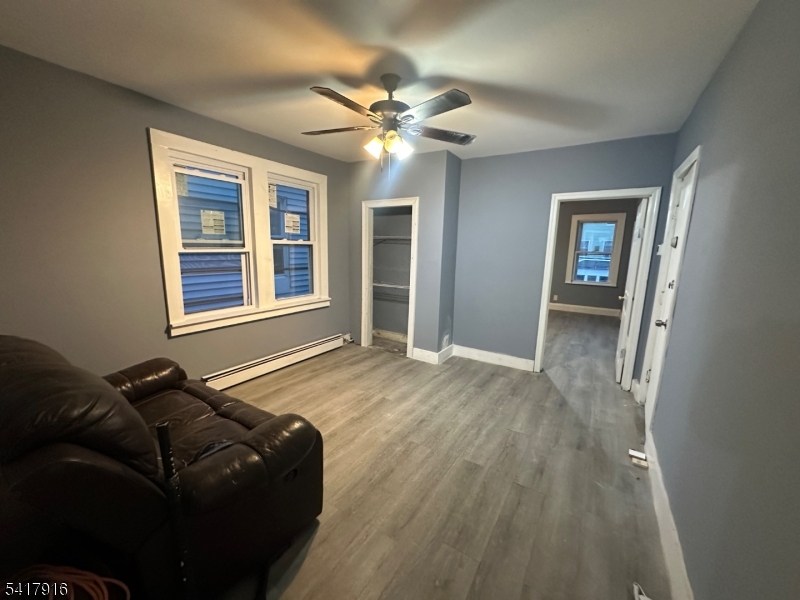 426 Franklin Street, Unit 2 Elizabeth Port, NJ 07206 - Photo 4 of 18 a living room with furniture and a window