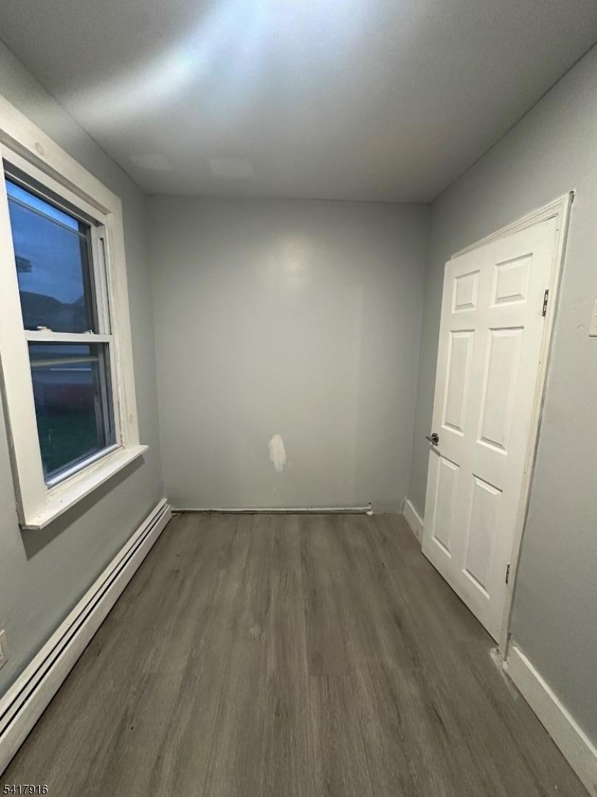 426 Franklin Street, Unit 2 Elizabeth Port, NJ 07206 - Photo 7 of 18 an empty room with windows