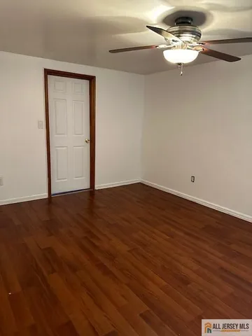 wooden floor in a hall with an entryway