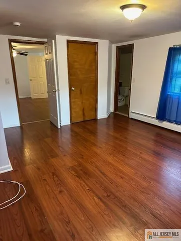 a view of a wooden fence and a bench