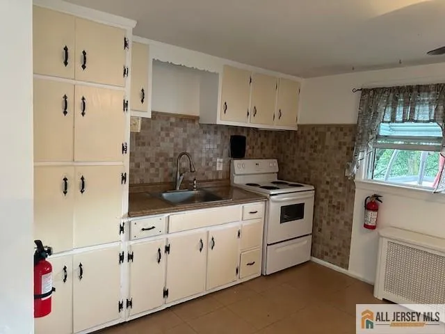 a kitchen with a cabinets and window