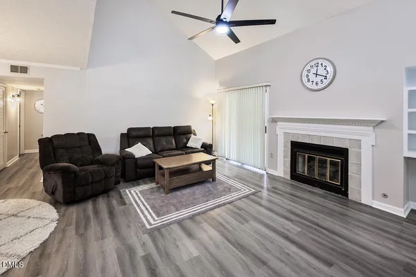a living room with furniture and a fireplace