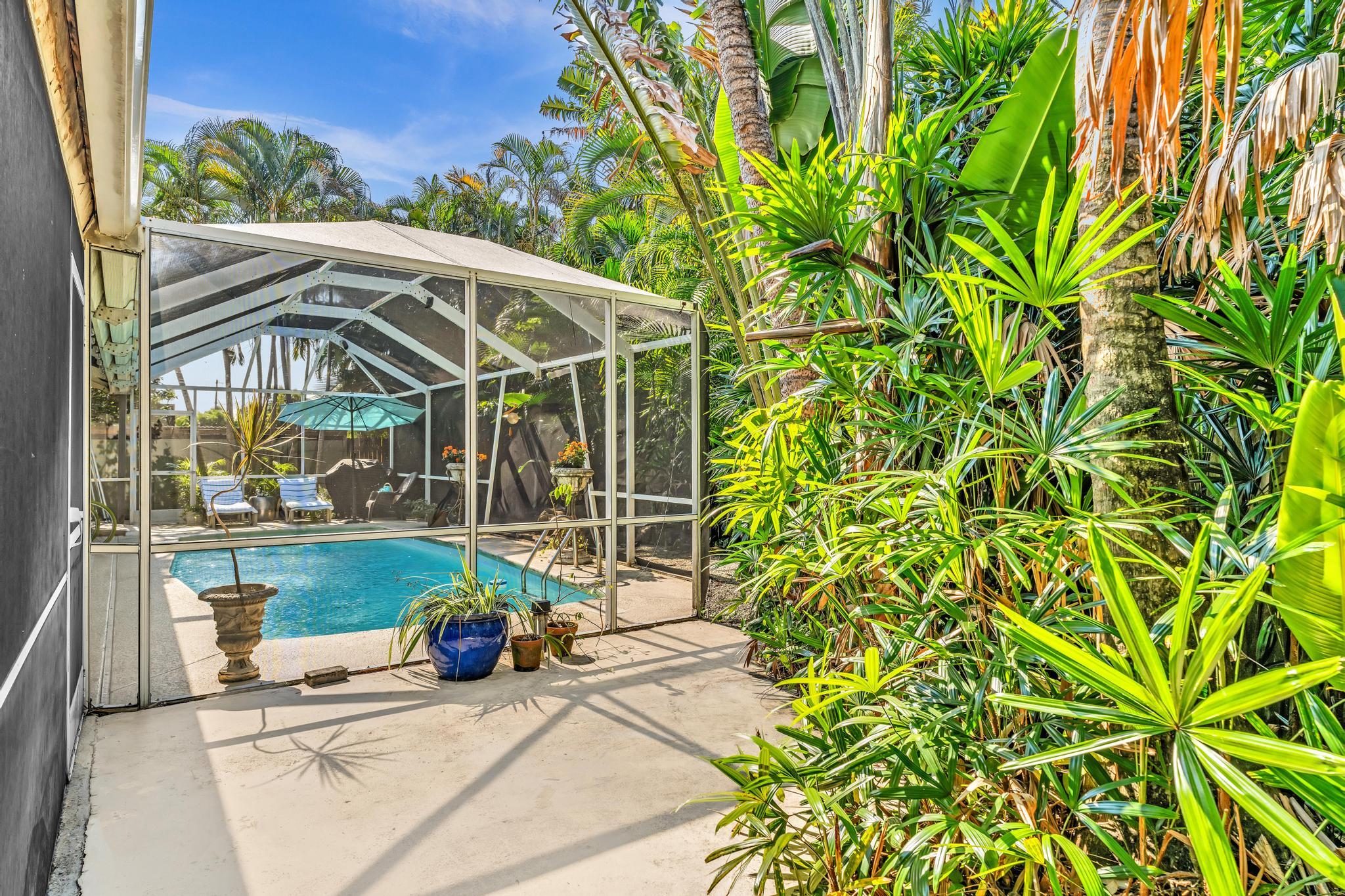 498 Oregon Lane Boca Raton, FL 33487 - Photo 54 of 77 a view of a chair and table in the garden