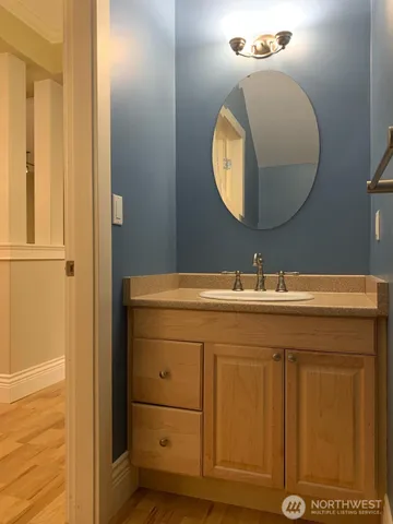 a bathroom with a sink and a mirror