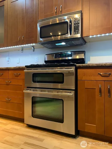 a kitchen with a stove and a microwave