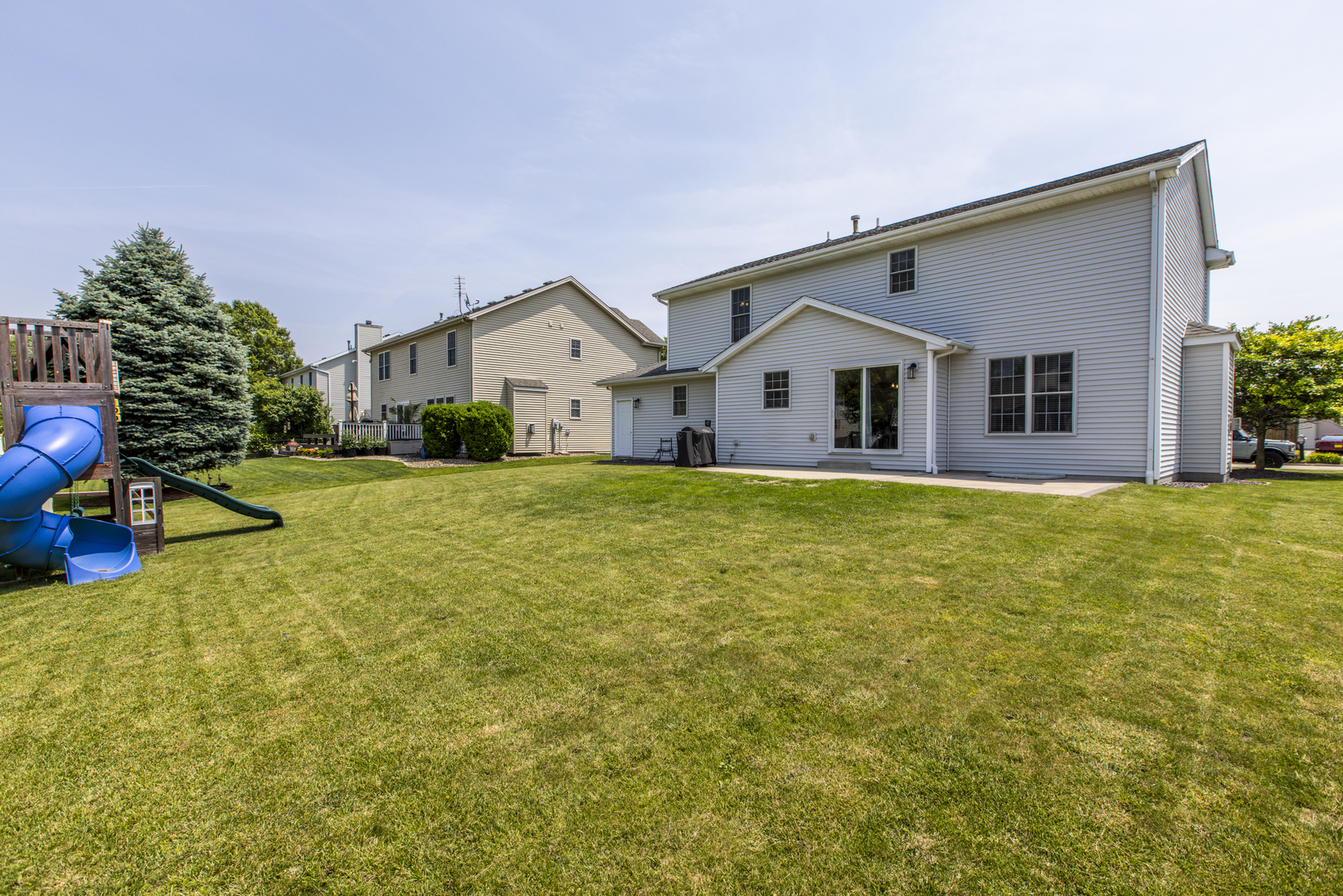 3230 Turquois Way Normal, IL 61761 - Photo 23 of 28 a view of a house with a big yard and large trees