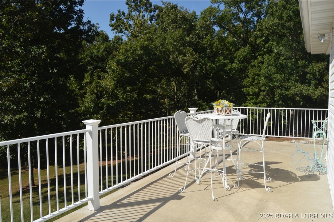 112 Rush Road Eldon, MO 65026 - Photo 16 of 50 Additional uncovered deck to enjoy the serene coun