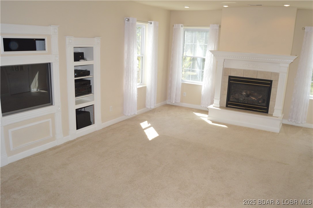 112 Rush Road Eldon, MO 65026 - Photo 22 of 50 Lower level living area with fireplace and built-i