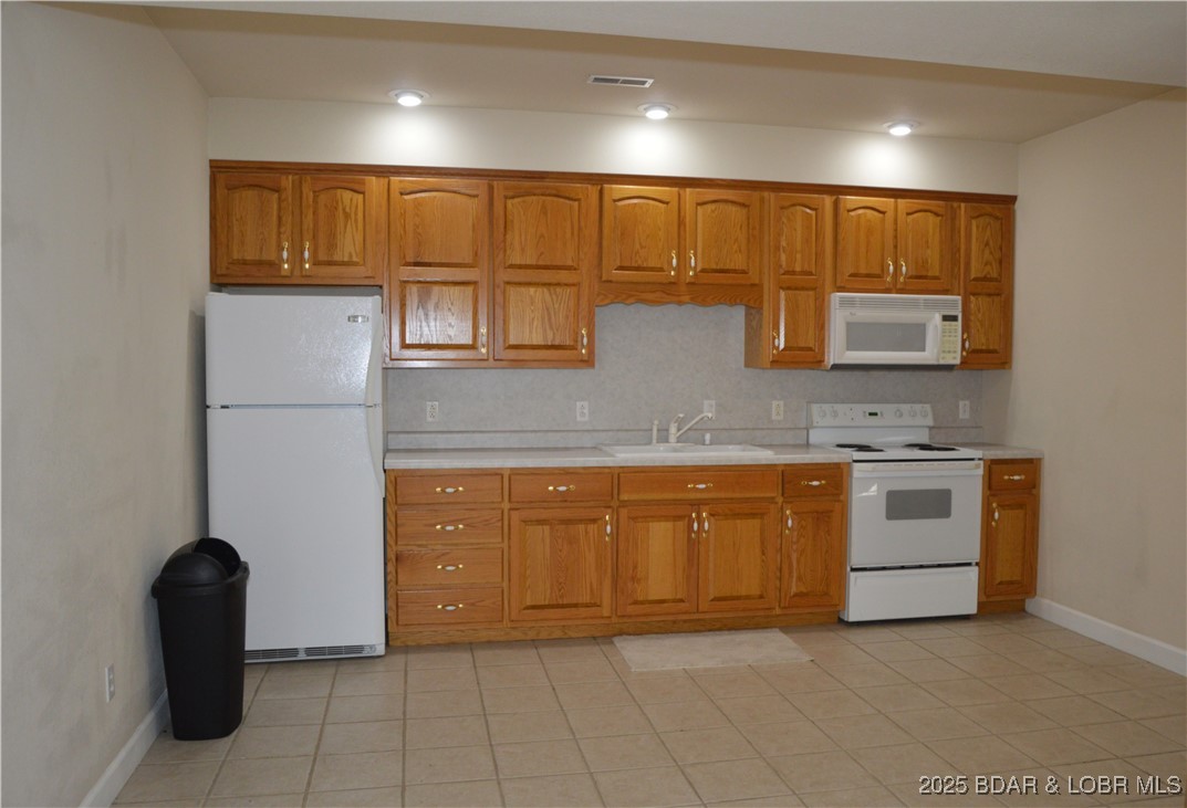 112 Rush Road Eldon, MO 65026 - Photo 25 of 50 Lower level provides second kitchen, great for lar