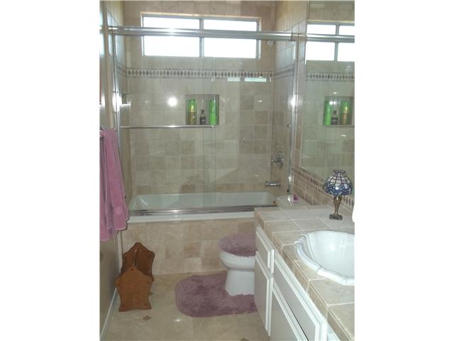 13666 Quinton Road San Diego, CA 92129 - Photo 12 of 25 Upgraded Second Floor Bathroom Features Travertine Tile, New Fixtures