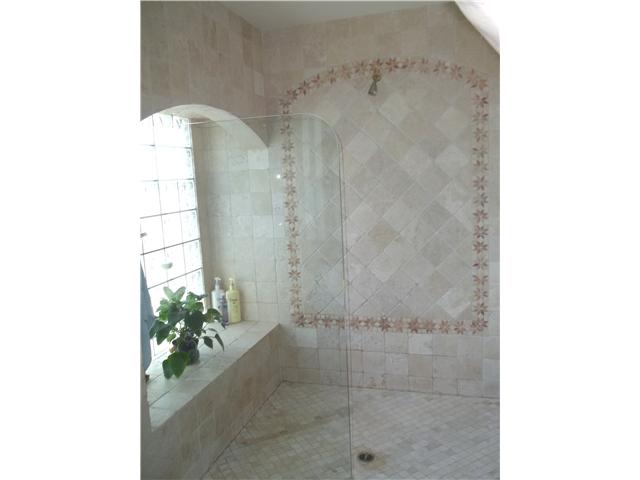 13666 Quinton Road San Diego, CA 92129 - Photo 13 of 25 Upgraded Master Bathroom Features Travertine Tile, New Fixtures, Spacious Shower Enclosure