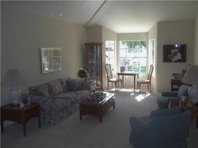 13666 Quinton Road San Diego, CA 92129 - Photo 9 of 25 Spacious Living Room Features Reading Nook Overlooking Front Yard