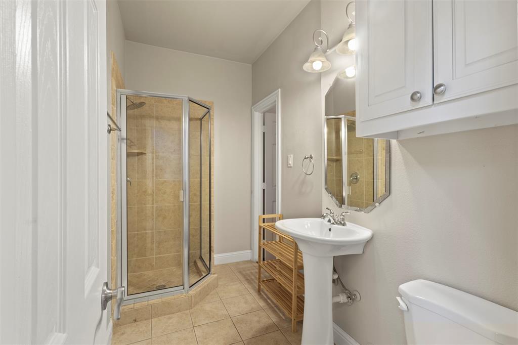 5617 Bryan Parkway, Unit 2 Dallas, TX 75206 - Photo 14 of 33 a bathroom with a sink and a mirror
