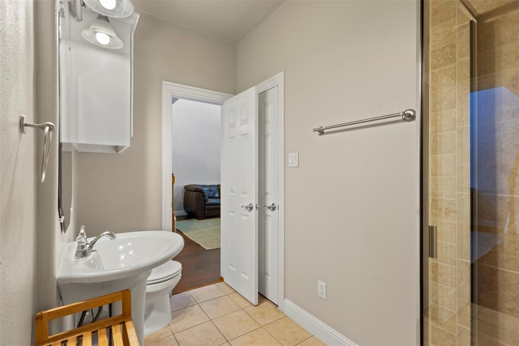 5617 Bryan Parkway, Unit 2 Dallas, TX 75206 - Photo 15 of 33 a bathroom with a sink toilet and shower