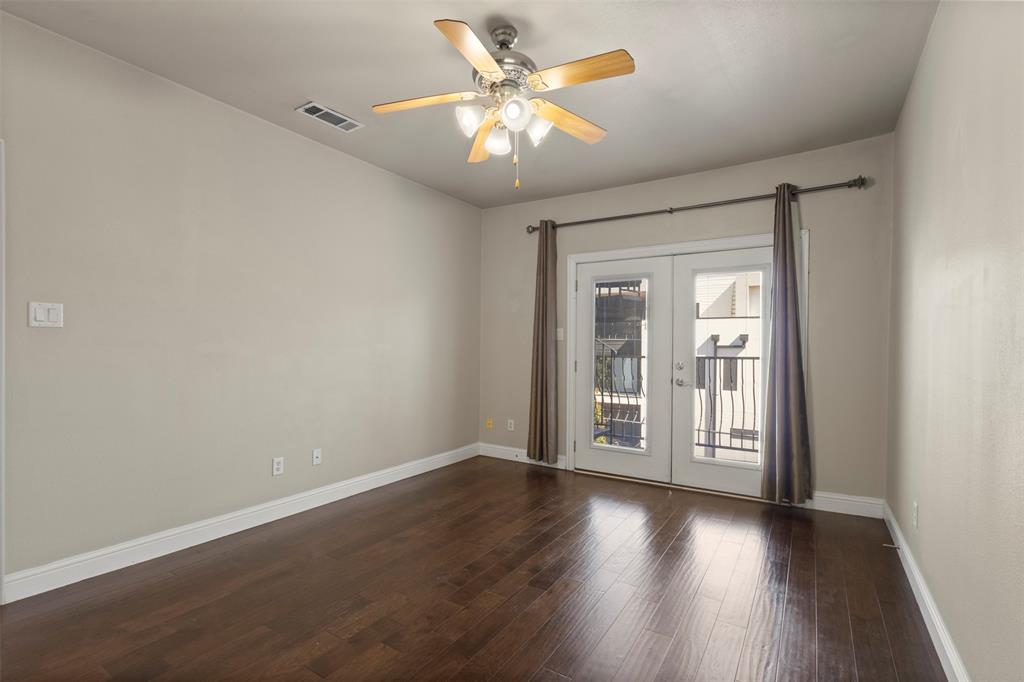 5617 Bryan Parkway, Unit 2 Dallas, TX 75206 - Photo 17 of 33 a view of an empty room with window and wooden floor