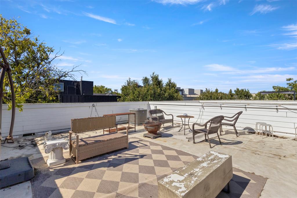 5617 Bryan Parkway, Unit 2 Dallas, TX 75206 - Photo 23 of 33 a terrace with outdoor seating and city view