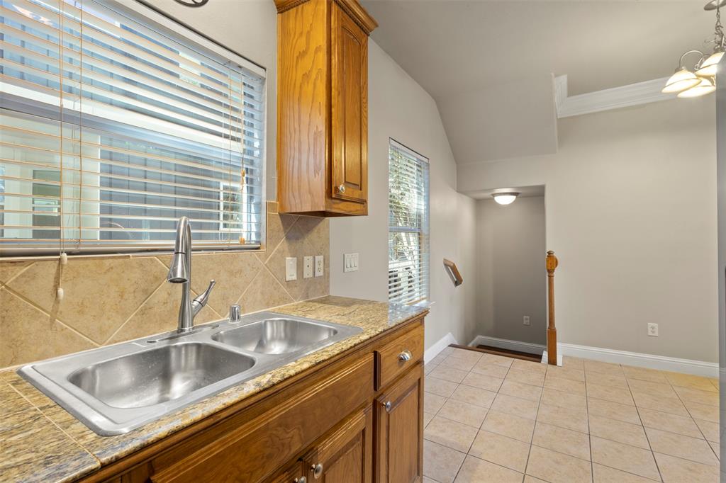 5617 Bryan Parkway, Unit 2 Dallas, TX 75206 - Photo 9 of 33 a kitchen that has a sink and cabinets