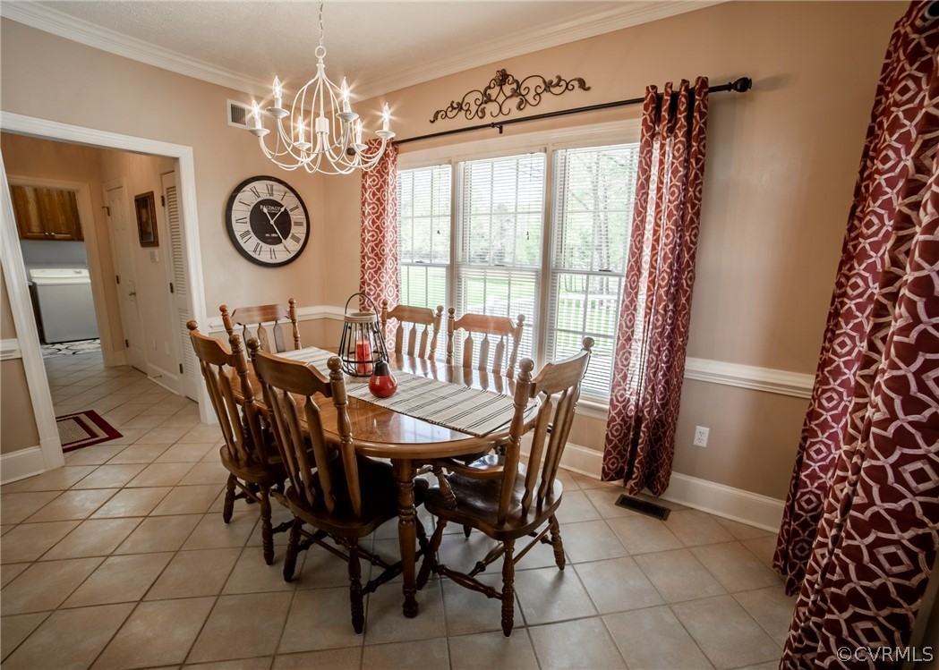 11239 Hanover Courthouse Road Hanover, VA 23069 - Photo 14 of 50 a view of a dining room with furniture and a chandelier