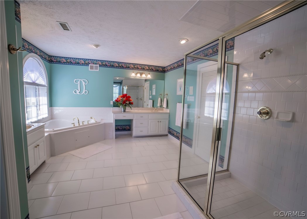 11239 Hanover Courthouse Road Hanover, VA 23069 - Photo 29 of 50 a bathroom with a tub shower and mirror