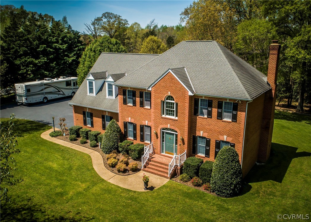 11239 Hanover Courthouse Road Hanover, VA 23069 - Photo 3 of 50 a front view of a house with garden