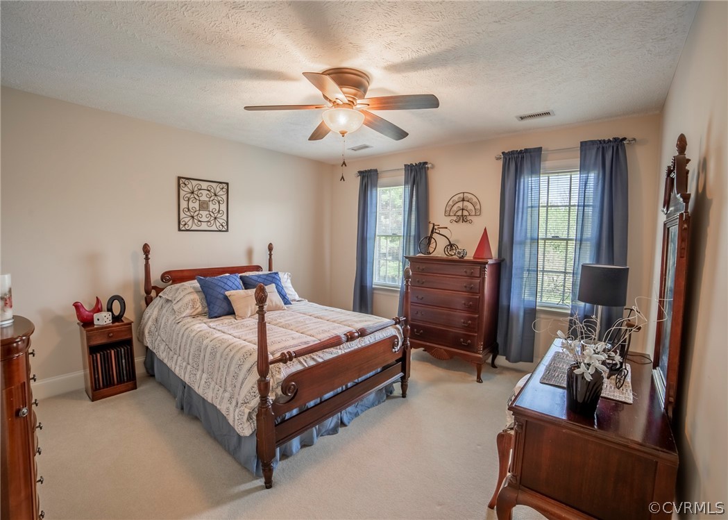 11239 Hanover Courthouse Road Hanover, VA 23069 - Photo 33 of 50 a bedroom with a bed and wooden floor