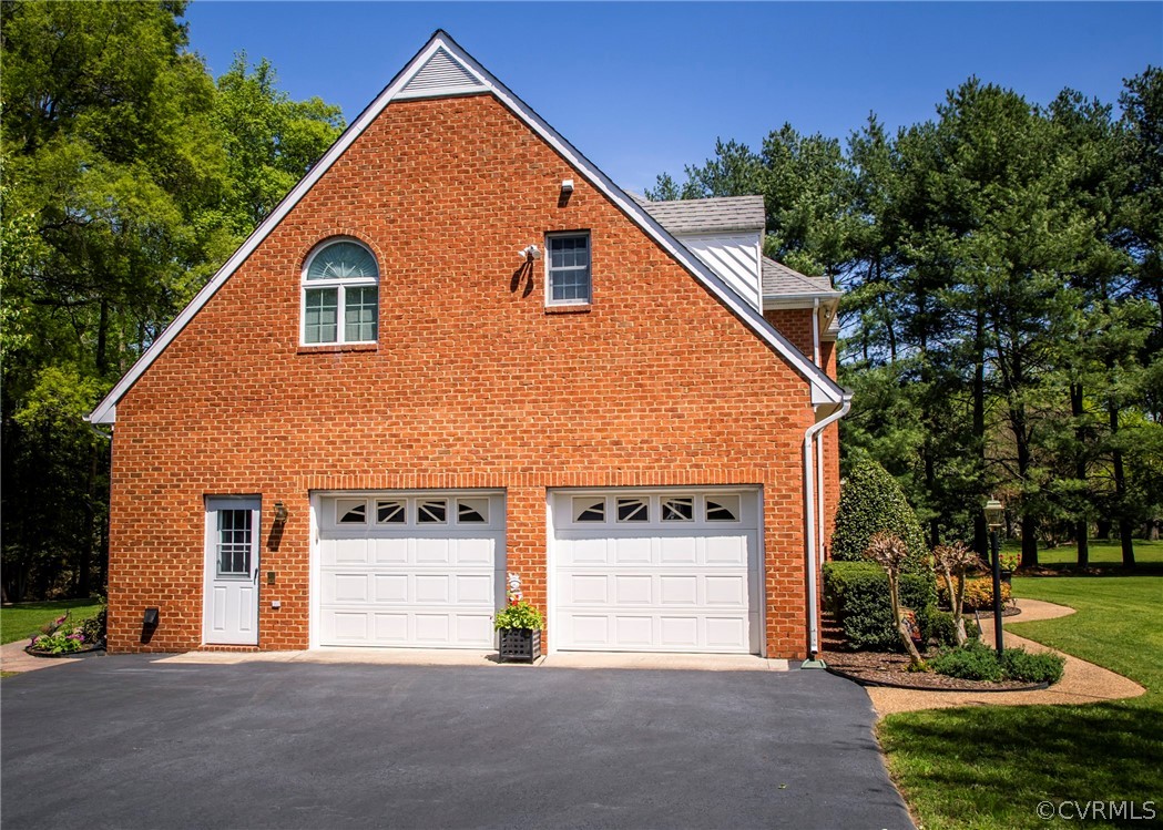 11239 Hanover Courthouse Road Hanover, VA 23069 - Photo 46 of 50 a view of a house with a yard and garage
